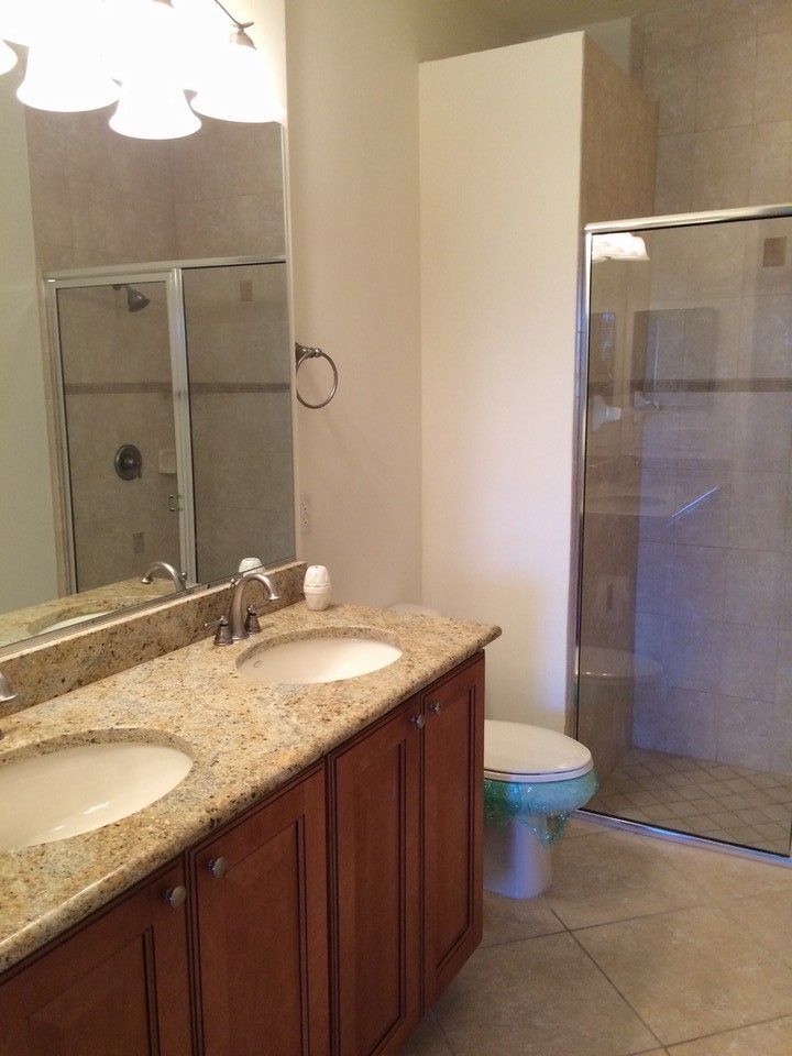 his/her sinks in master bath with granite counter tops