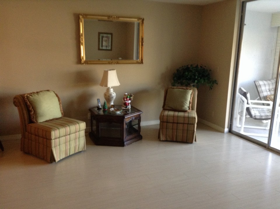 great room with sliders opening to balcony