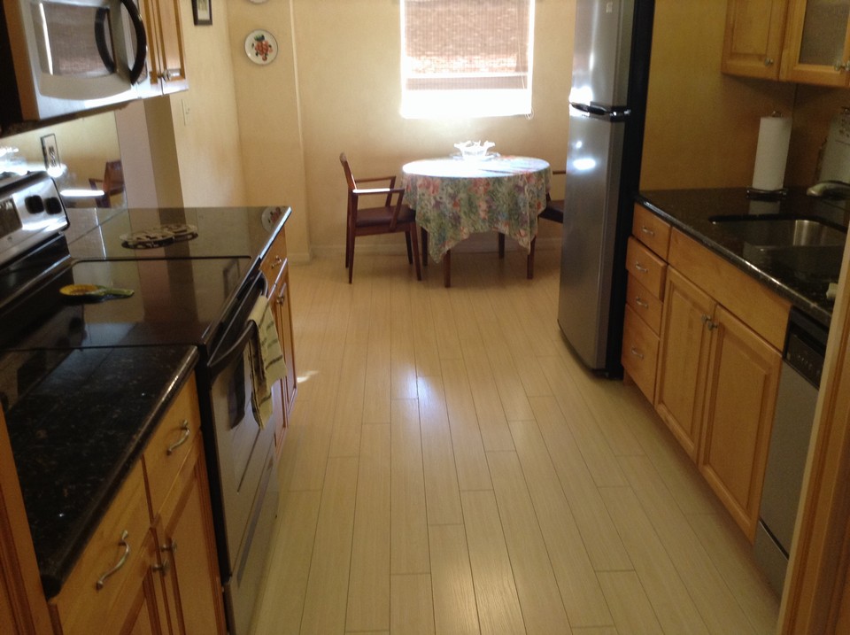 kitchen with granite counters looking to breakfast nook