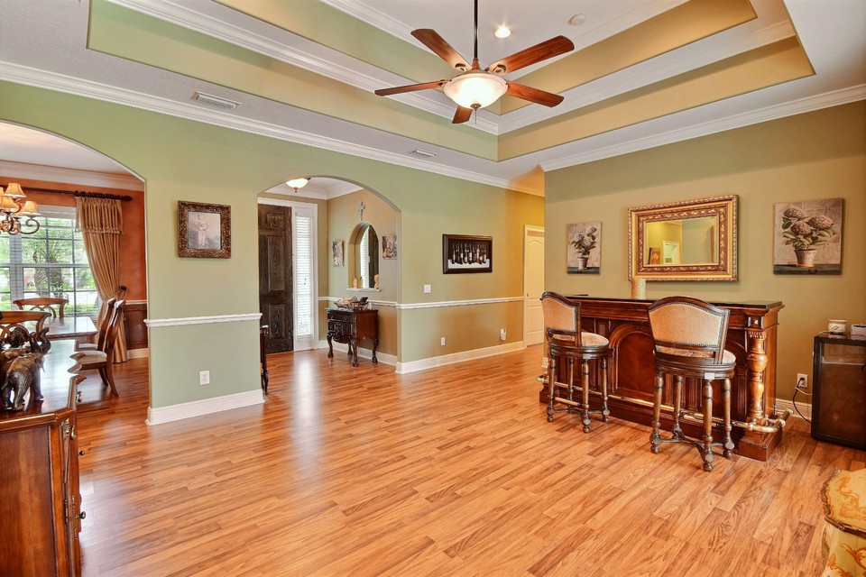 living room with double tray ceiling