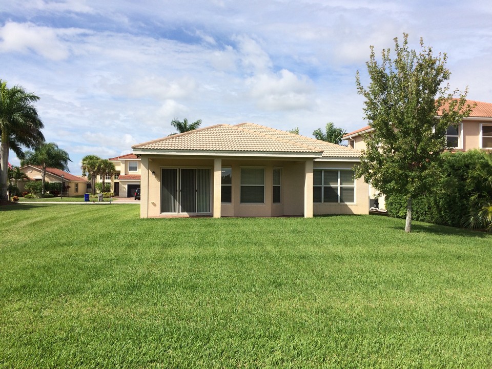 large backyard with green space to the left