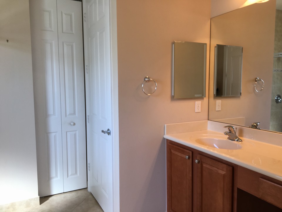 master bath with cultured marble counter