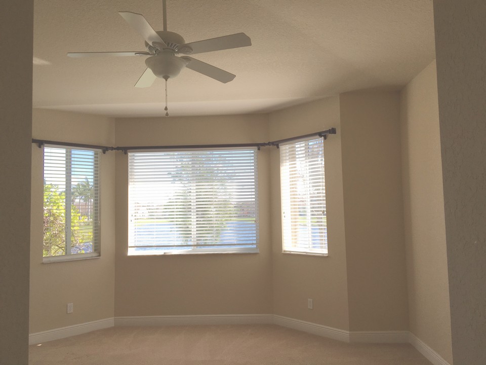 master bedroom with bay window overlooking lake