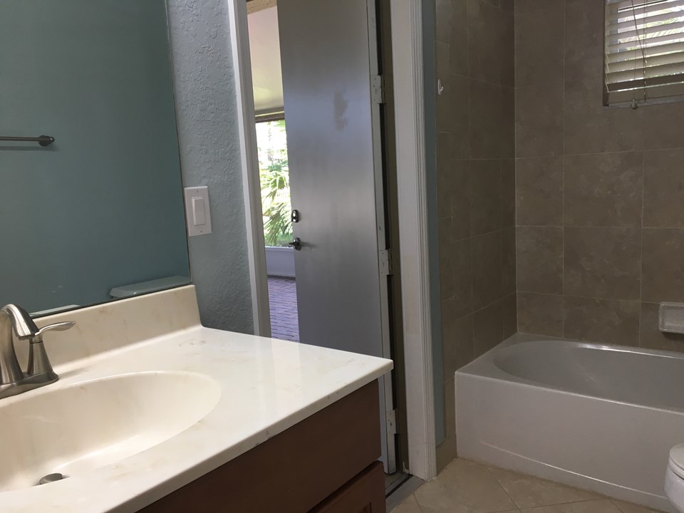 guest bath with cabana door to patio