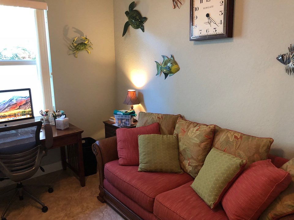 den/office/bedroom with closet