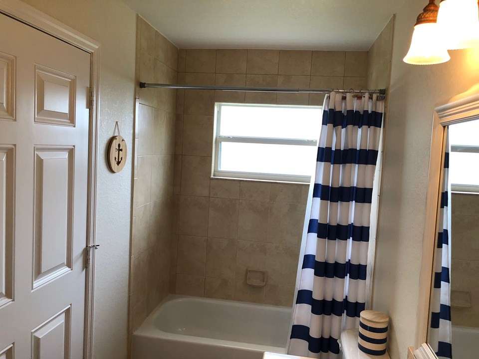 bath with cabana door to patio