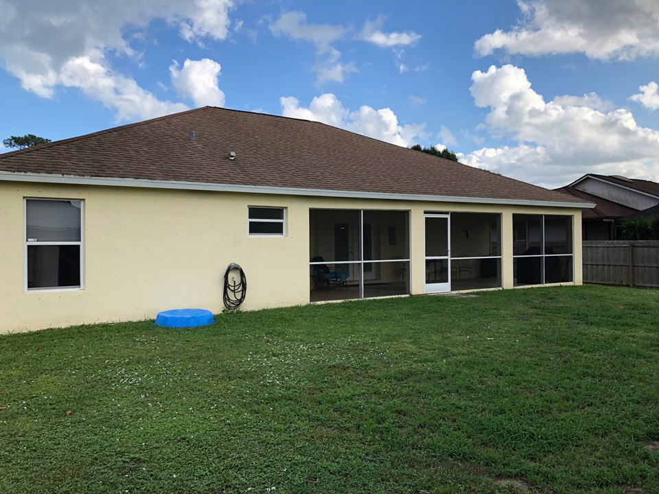 back view of house, fenced yard