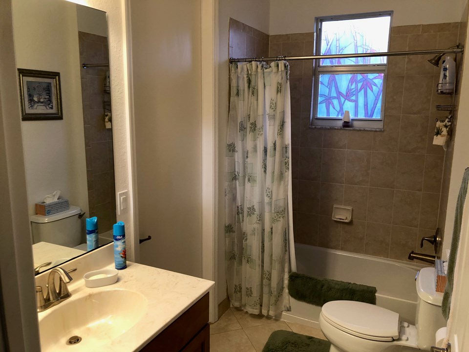 guest bath with cabana door to patio