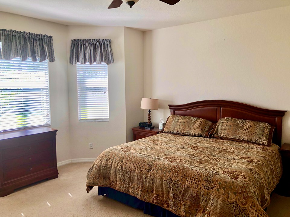 master bedroom with bay window