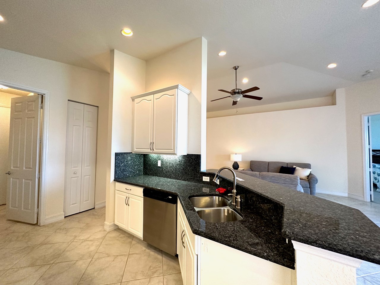 kitchen with white cabinets and granite counters