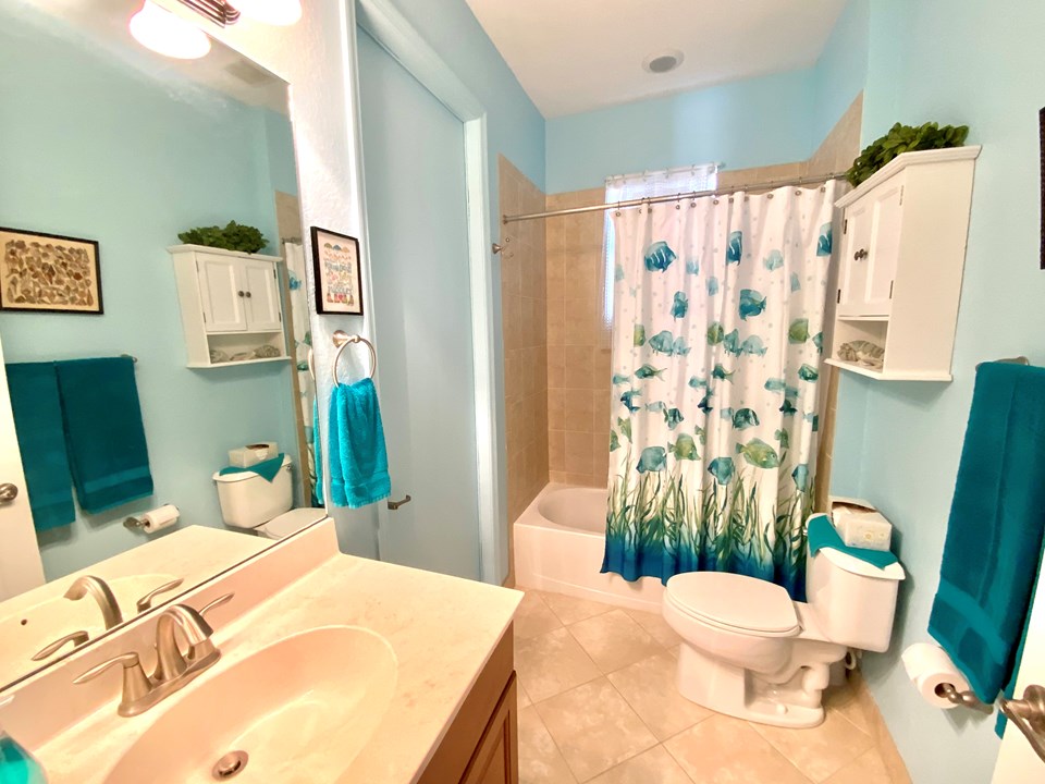 guest bath with cabana door to patio