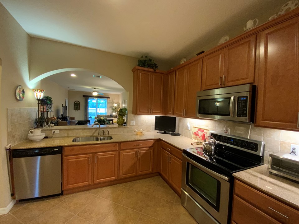 kitchen with snack counter looking to living/dining room