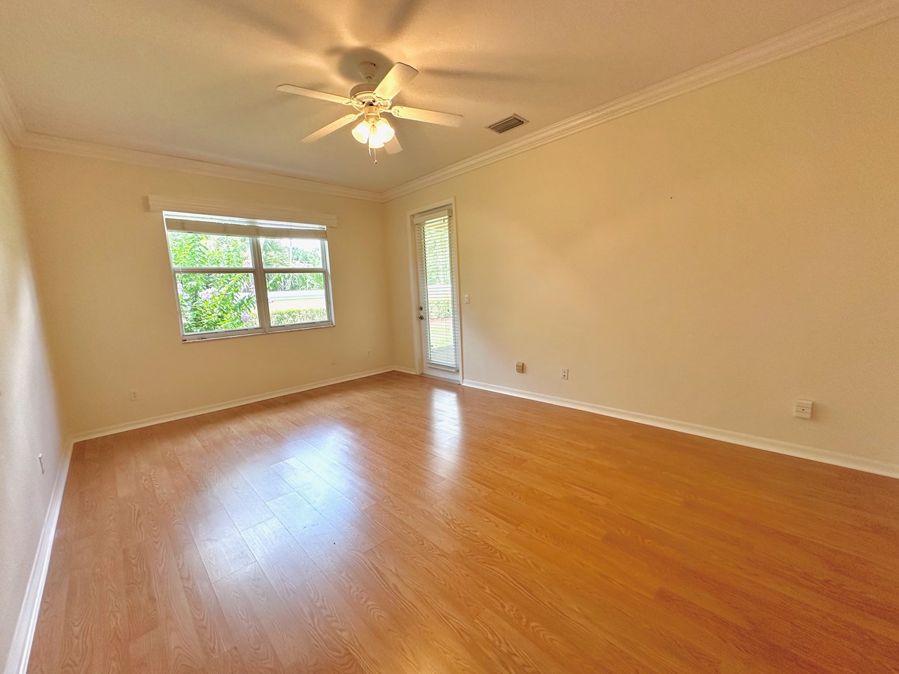 owners bedroom with door to patio