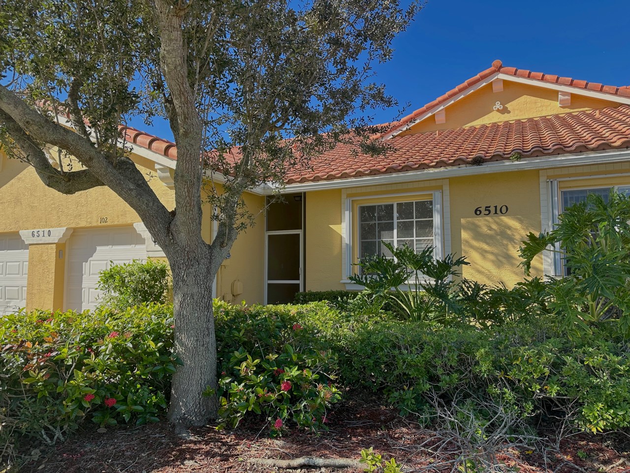 front with 1 car garage, screened entry & accordion shutters