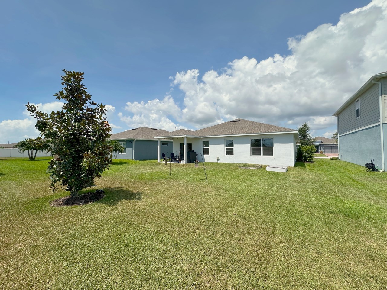 back yard and view of house