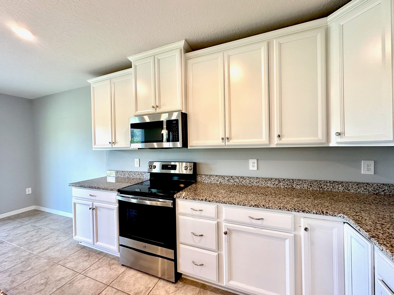 granite counter tops/white cabinets