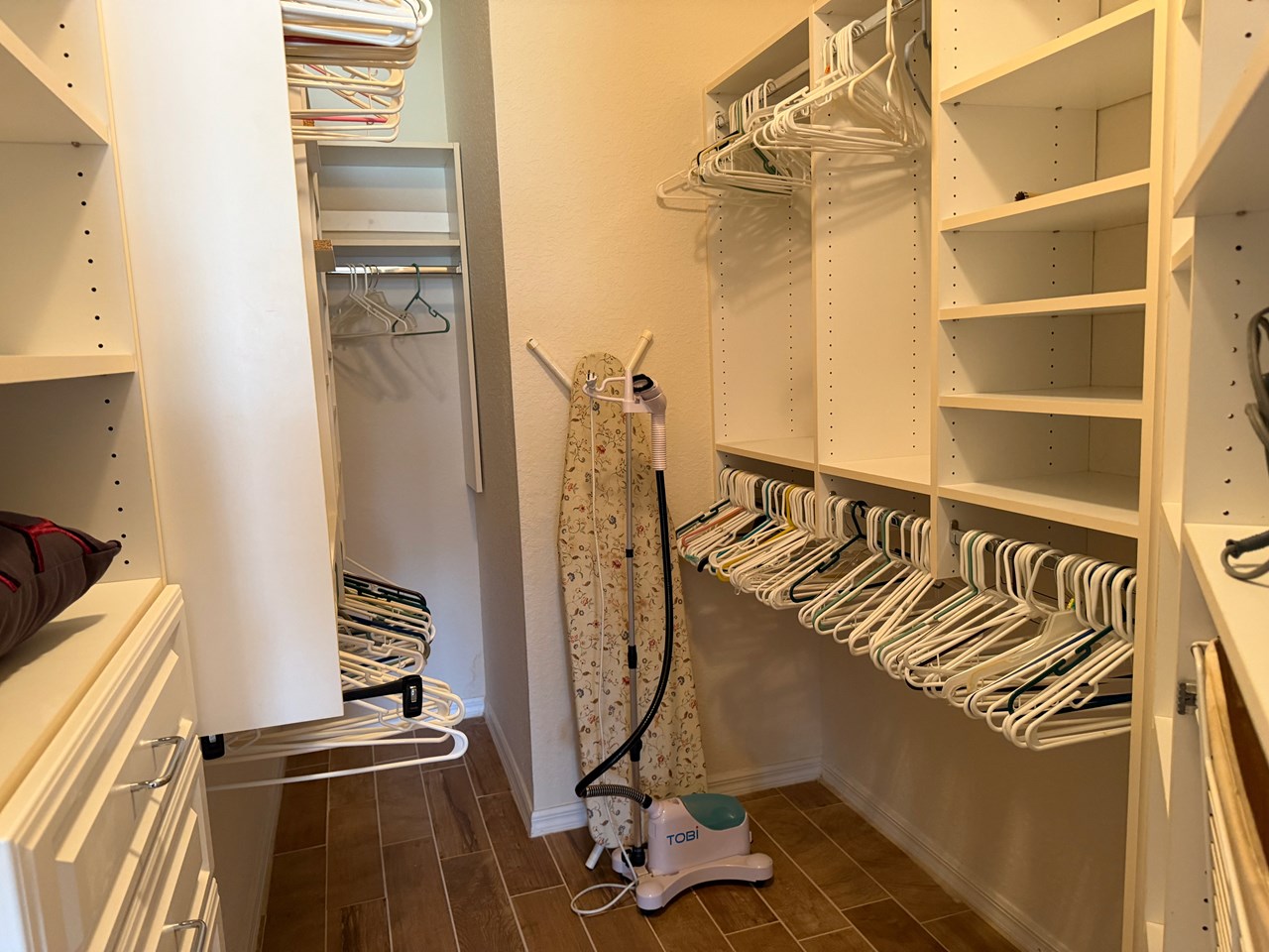 custom closet system -master bedroom walk in closet