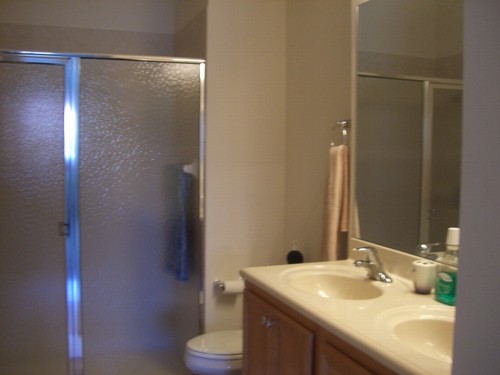 master bath with shower and his & her sinks