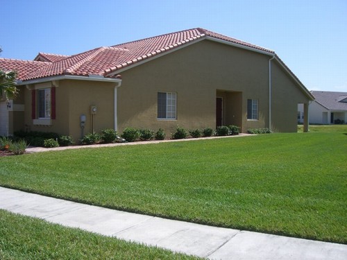 large side yard with entrance to villa